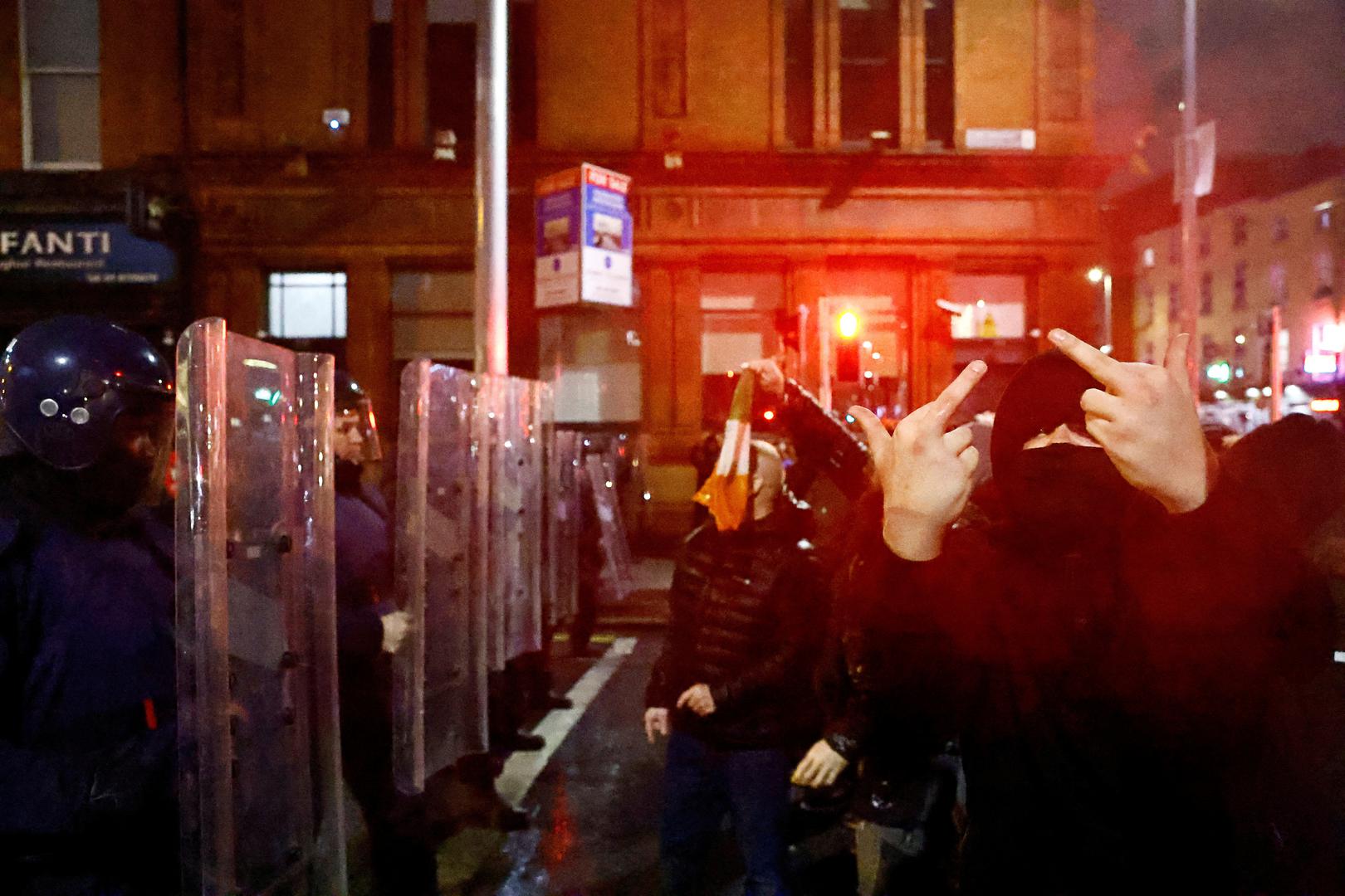 SENSITIVE MATERIAL. THIS IMAGE MAY OFFEND OR DISTURB    A demonstrator gestures in front of riot police near the scene of a suspected stabbing that left few children injured in Dublin, Ireland, November 23, 2023. REUTERS/Clodagh Kilcoyne Photo: Clodagh Kilcoyne/REUTERS