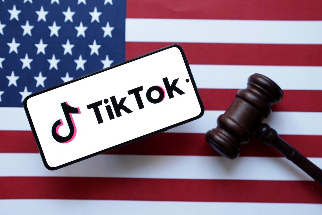 Illustration shows Tik Tok logo, U.S. flag and a judge gavel