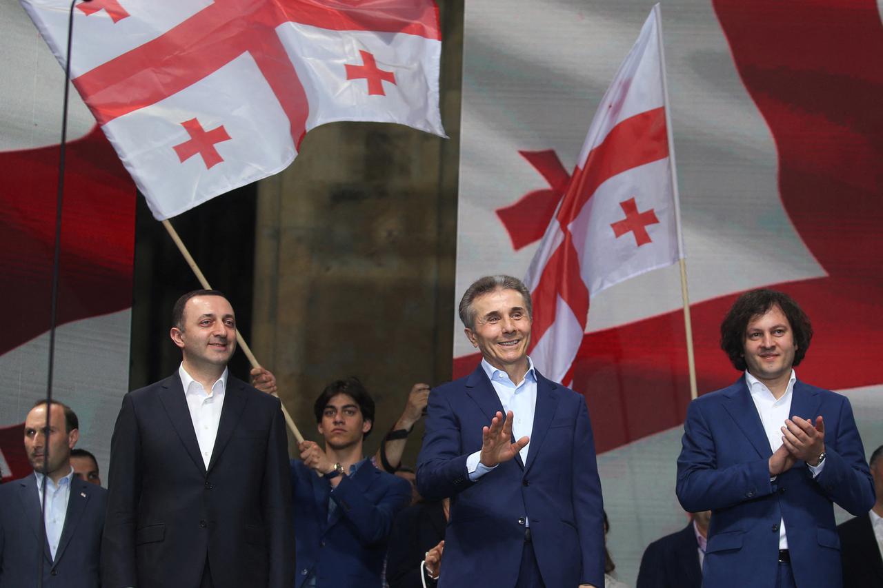 Georgian Prime Minister Irakli Kobakhidze (R), former prime minister and chairman of the Georgian Dream party Irakli Garibashvili (L) and former prime minister and founder of the Georgian Dream party Bidzina Ivanishvili