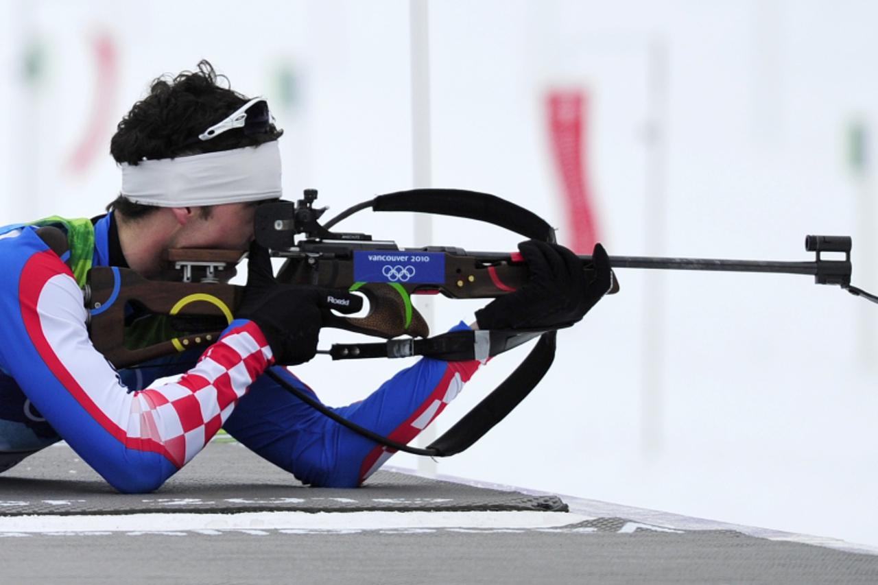 'Croatia\'s Jakov Fak shoots his rifle during the men\'s Biathlon 10 km Sprint at Whistler Olympic Park Biathlon Stadium on February 14, 2010 during the Vancouver Winter Olympics.         AFP PHOTO DD