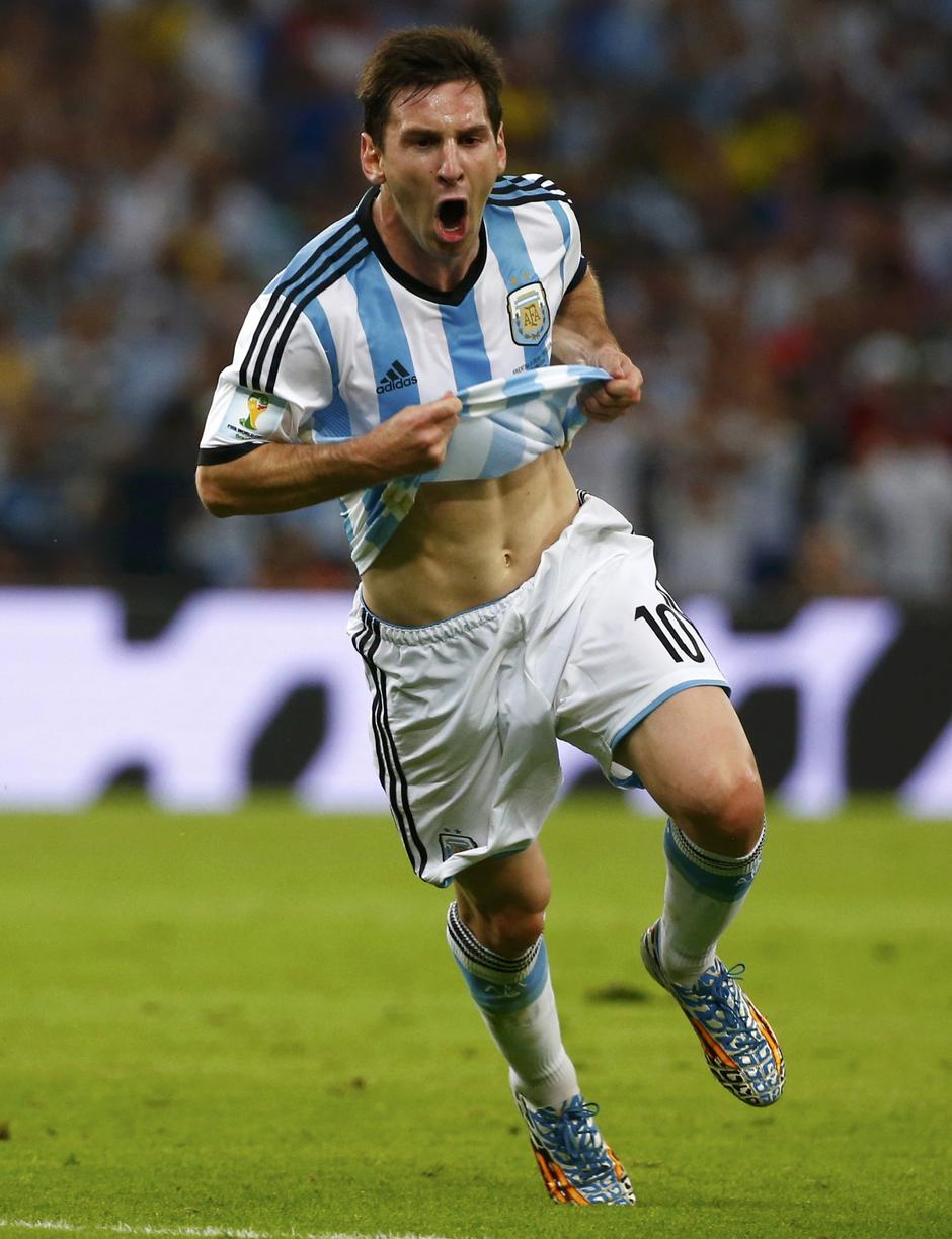 Argentina's Lionel Messi celebrates scoring a goal during the 2014 World Cup Group F soccer match against Bosnia and Herzegovina at the Maracana stadium in Rio de Janeiro June 15, 2014. REUTERS/Michael Dalder (BRAZIL  - Tags: SOCCER SPORT WORLD CUP)      