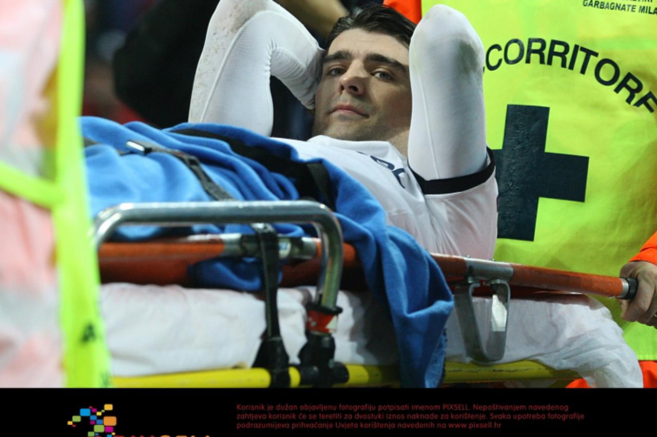 'Tottenham Hotspur\'s Vedran Corluka is stretchered off the picth after suffering an ankle injury Photo: Press Association/Pixsell'