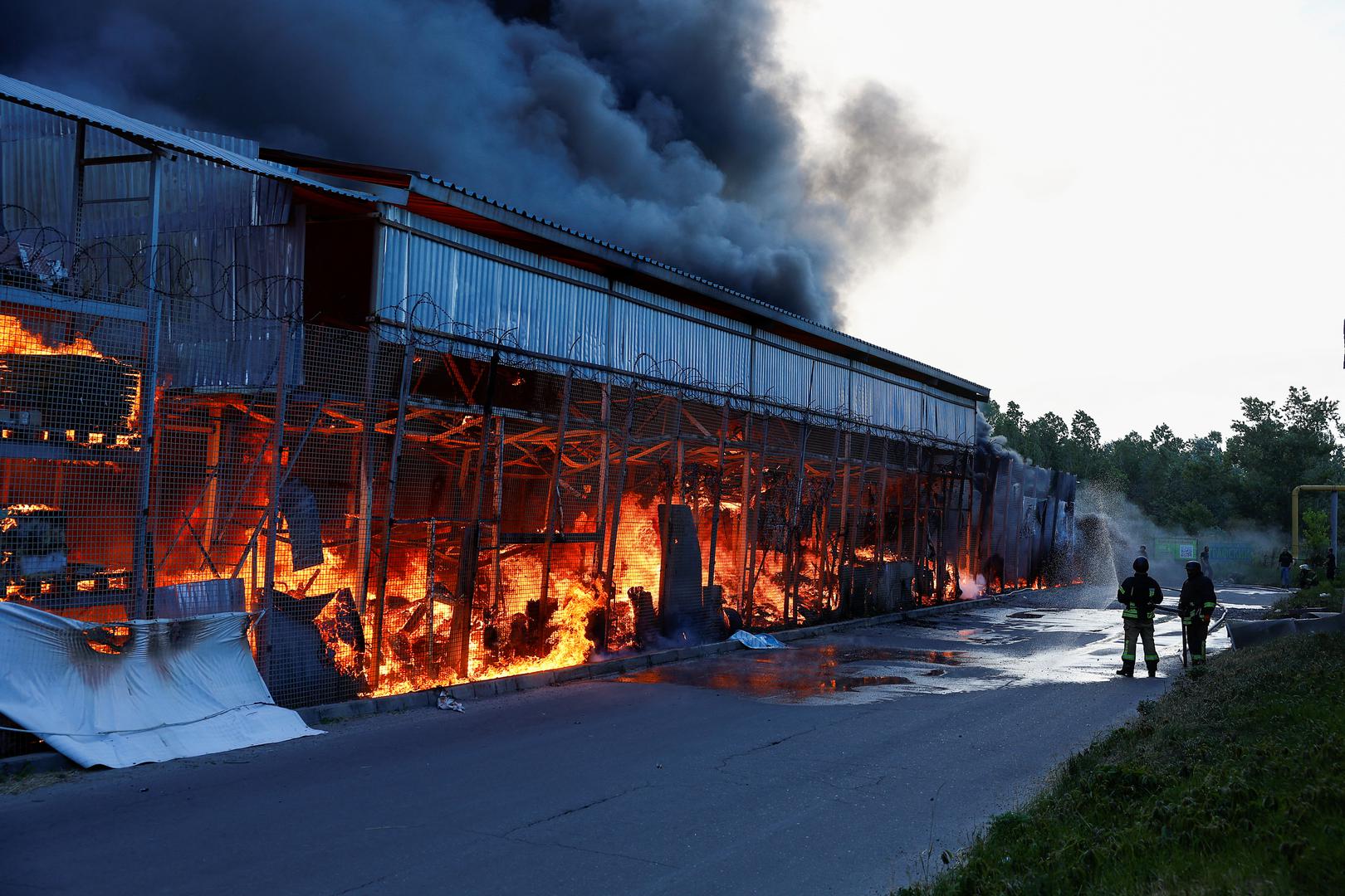 Firefighters work at a site of a household item shopping mall hit by a Russian air strike, amid Russia's attack on Ukraine, in Kharkiv, Ukraine May 25, 2024. REUTERS/Valentyn Ogirenko Photo: VALENTYN OGIRENKO/REUTERS