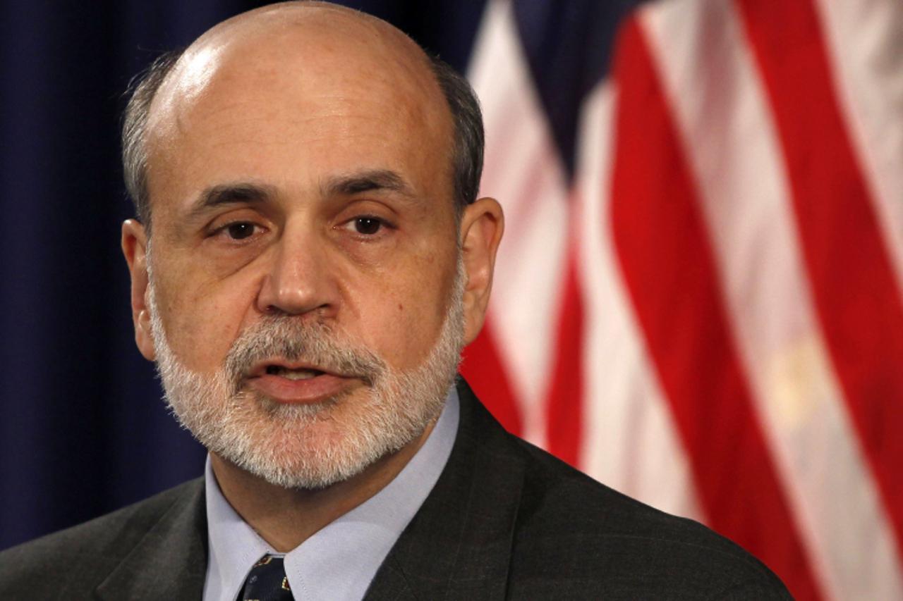 'Chairman of the Federal Reserve Ben Bernanke talks at a news conference at the William McChesney Martin Federal Reserve Board Building in Washington, January 25, 2012.     REUTERS/Larry Downing     (