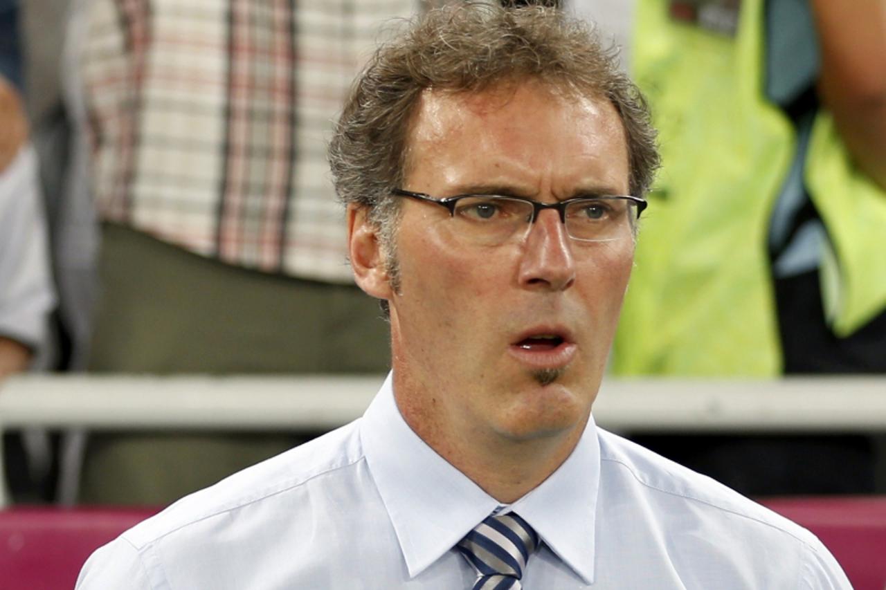 'France\'s coach Laurent Blanc sings the national anthem before their Euro 2012 quarter-final soccer match against Spain at Donbass Arena in Donetsk, June 23, 2012. REUTERS/Charles Platiau (UKRAINE  -