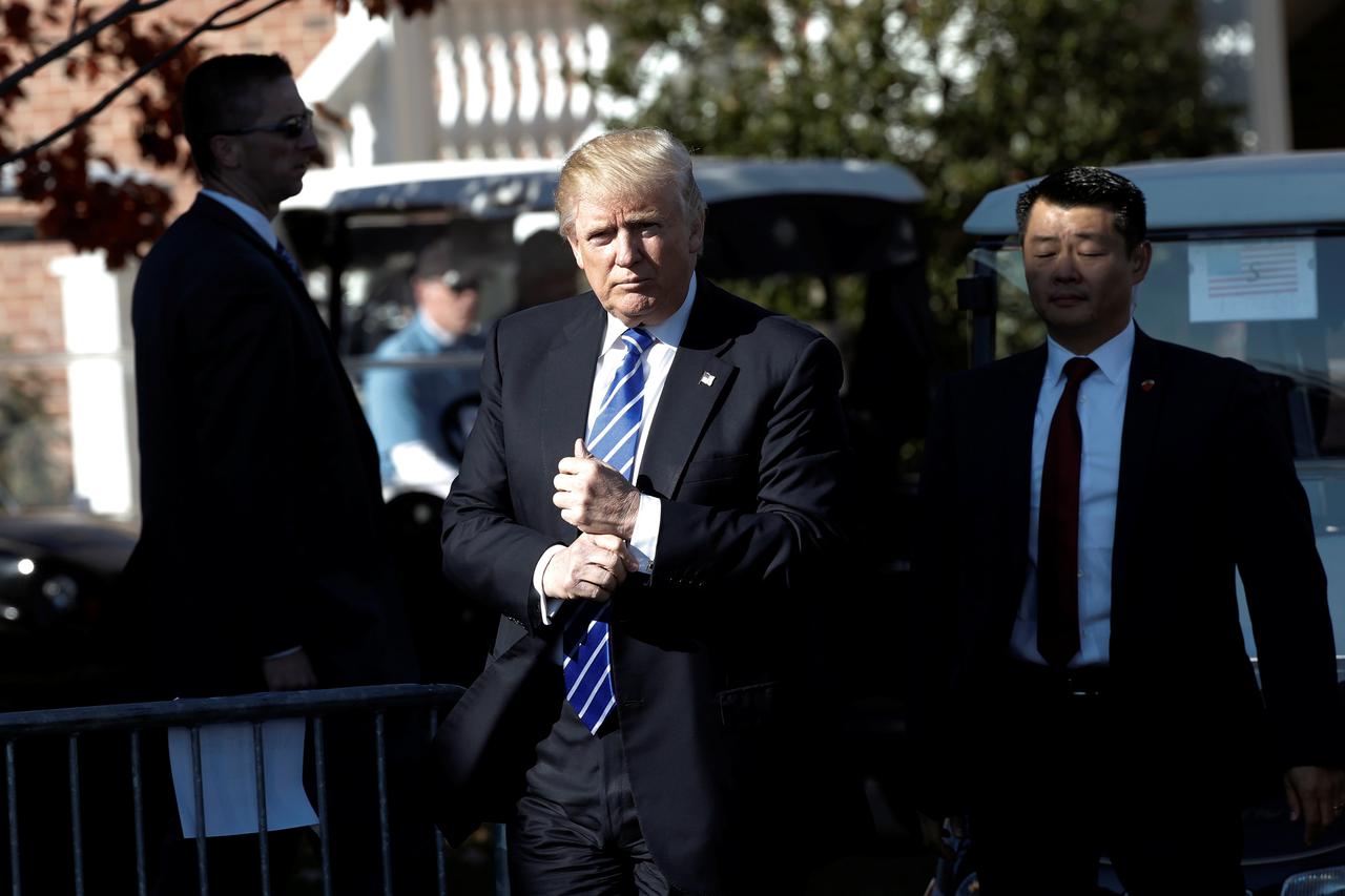 U.S. President-elect Donald Trump gestures as he arrives at the the main clubhouse at Trump National Golf Club in Bedminster, New Jersey, U.S., November 19, 2016.  REUTERS/Mike Segar