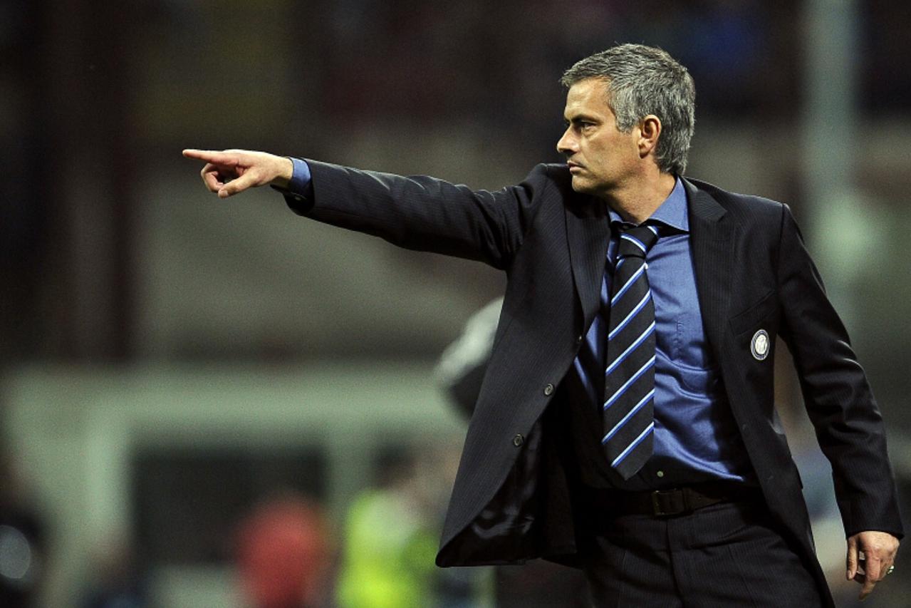 'Inter Milan\'s Portuguese coach Jose Mourinho gestures during their UEFA Champions League first leg semifinal football match against Inter Milan on April 20, 2010 in Milan\'s San Siro stadium. AFP PH