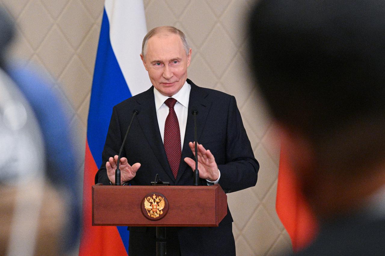 Russian President Putin attends a press conference in Astana