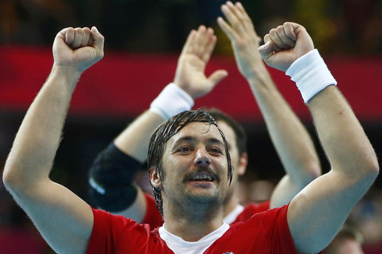 'Croatia\'s Zlatko Horvat celebrates after defeating Denmark in their men\'s handball Preliminaries Group B match at the Copper Box venue during the London 2012 Olympic Games August 4, 2012. REUTERS/M