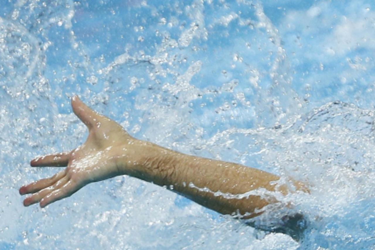 'Croatia\'s Samir Barac reaches for the ball during their men\'s preliminary round Group A water polo match against Italy at the London 2012 Olympic Games at the Water Polo Arena August 2, 2012.      