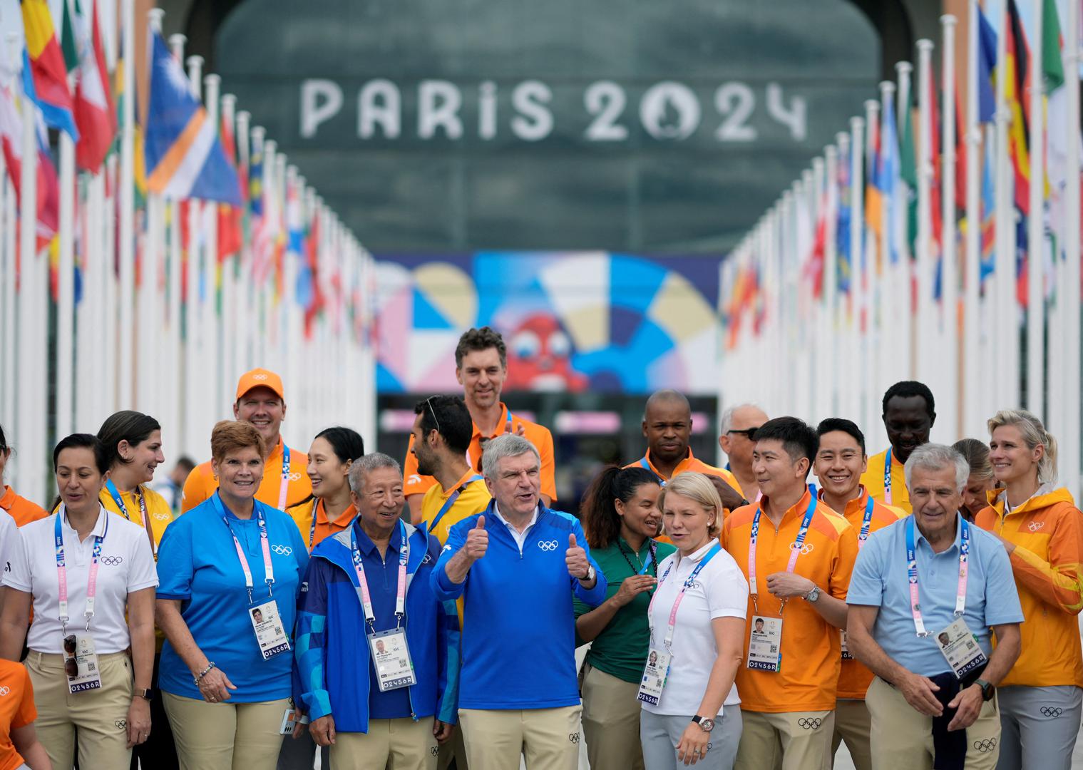 Paris 2024 Olympics - IOC President Thomas Bach tours the athletes village - Olympic Village, Paris, France - July 22, 2024  International Olympic Committee (IOC) President Thomas Bach poses for a photograph with IOC staff members as he tours the athletes village ahead of the Paris 2024 Olympics  David Goldman/Pool via REUTERS Photo: Pool via Reuters/REUTERS