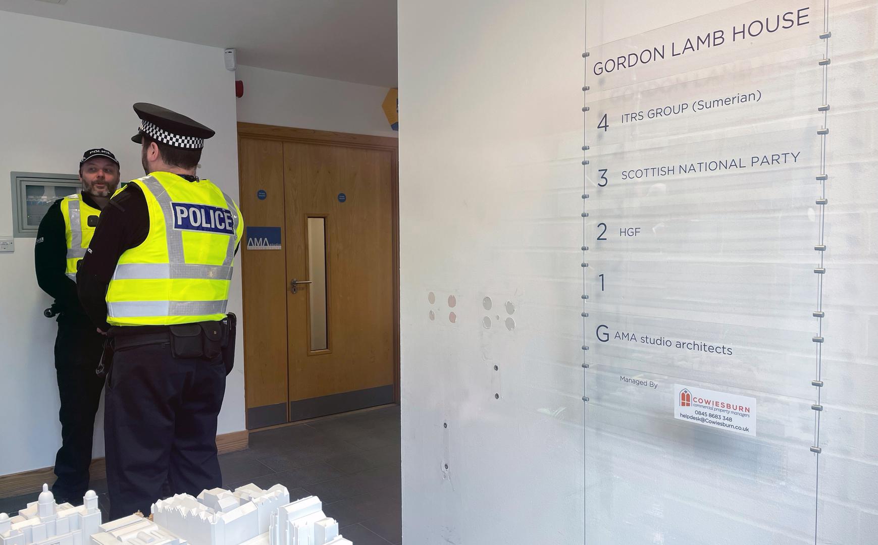 Officers from Police Scotland inside the reception area of the headquarters of the Scottish National Party (SNP) in Edinburgh following the arrest of former chief executive Peter Murrell. Police Scotland are conducting searches at a number of properties in connection with the ongoing investigation into the funding and finances of the party. Picture date: Wednesday April 5, 2023. Photo: Jane Barlow/PRESS ASSOCIATION