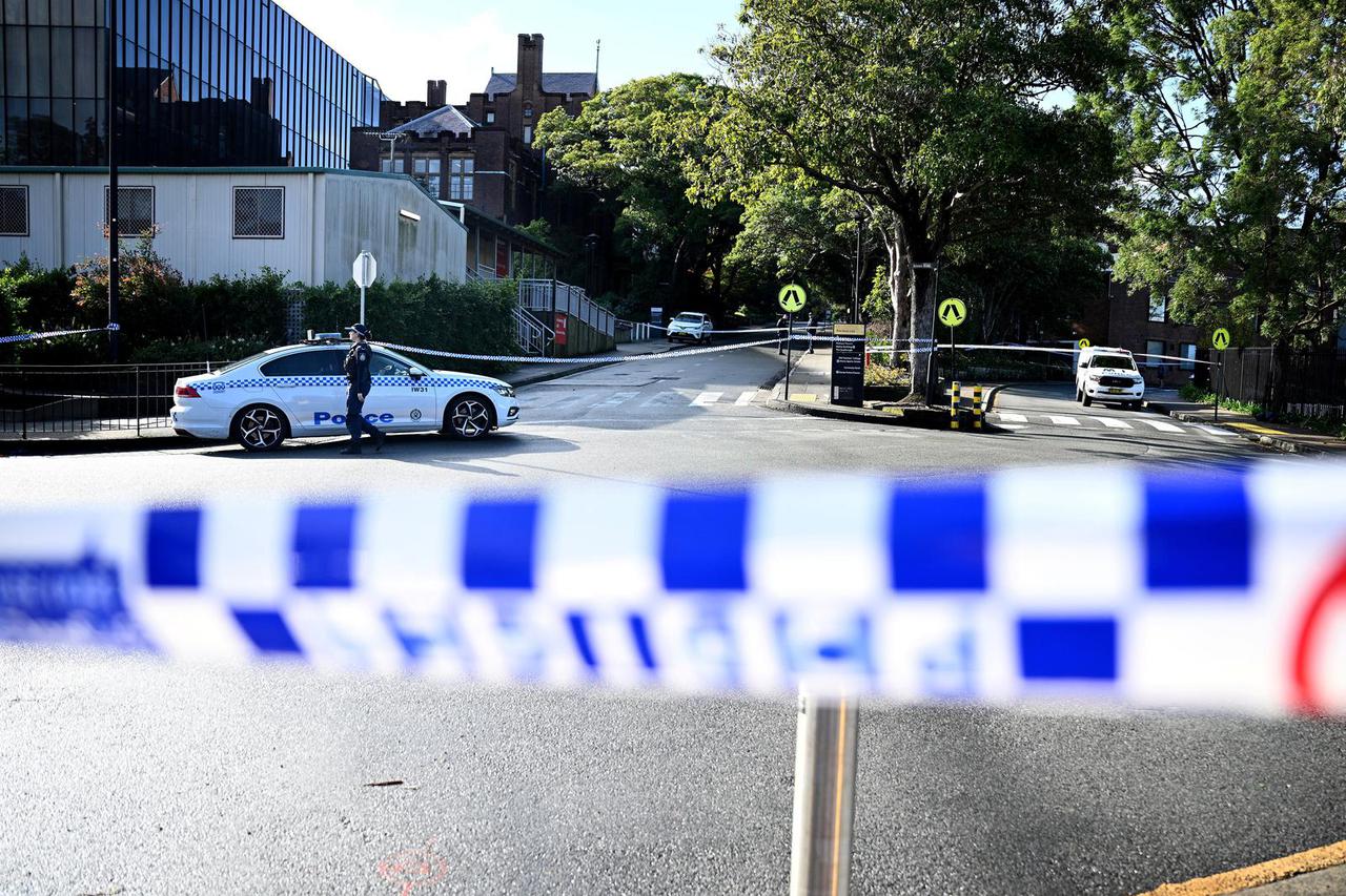 NSW Police work at the scene of an alleged stabbing at University of Sydney