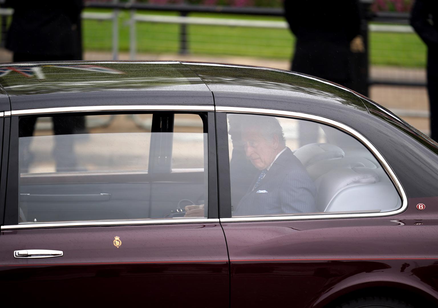 King Charles III and Queen Camilla arrive by car at Buckingham Palace in London ahead of their coronation ceremony. Picture date: Saturday May 6, 2023. Photo: Niall Carson/PRESS ASSOCIATION