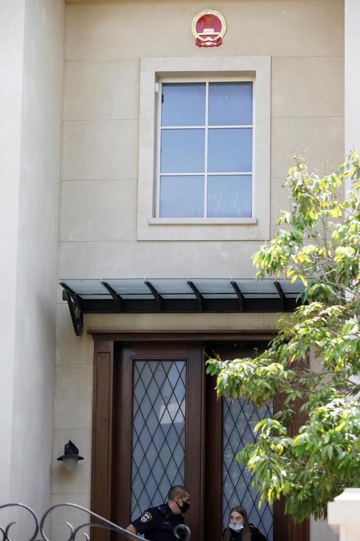 Israeli police are seen at the door of China's ambassador to Israel, Du Wei's home in Herzliya, near Tel Aviv, Israel Israeli police are seen at the door of China's ambassador to Israel, Du Wei's home in Herzliya, near Tel Aviv, Israel May 17, 2020. REUTERS/Nir Elias NIR ELIAS