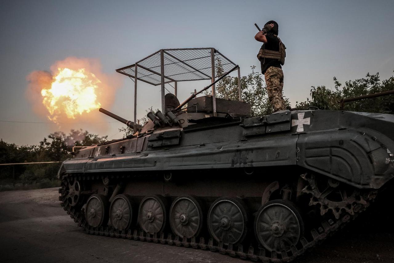 Ukrainian servicemen fire a BRM-1K infantry fighting vehicle towards Russian troops at a frontline near the town of Chasiv Yar