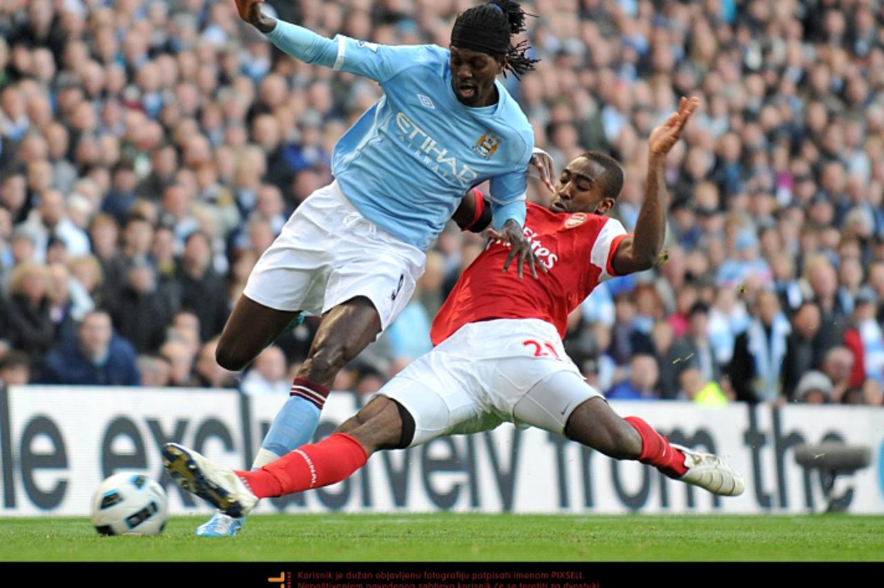 'Manchester City\'s Emmanuel Adebayor (left) and Arsenal\'s Johan Djourou battle for the ball Photo: Press Association/Pixsell'