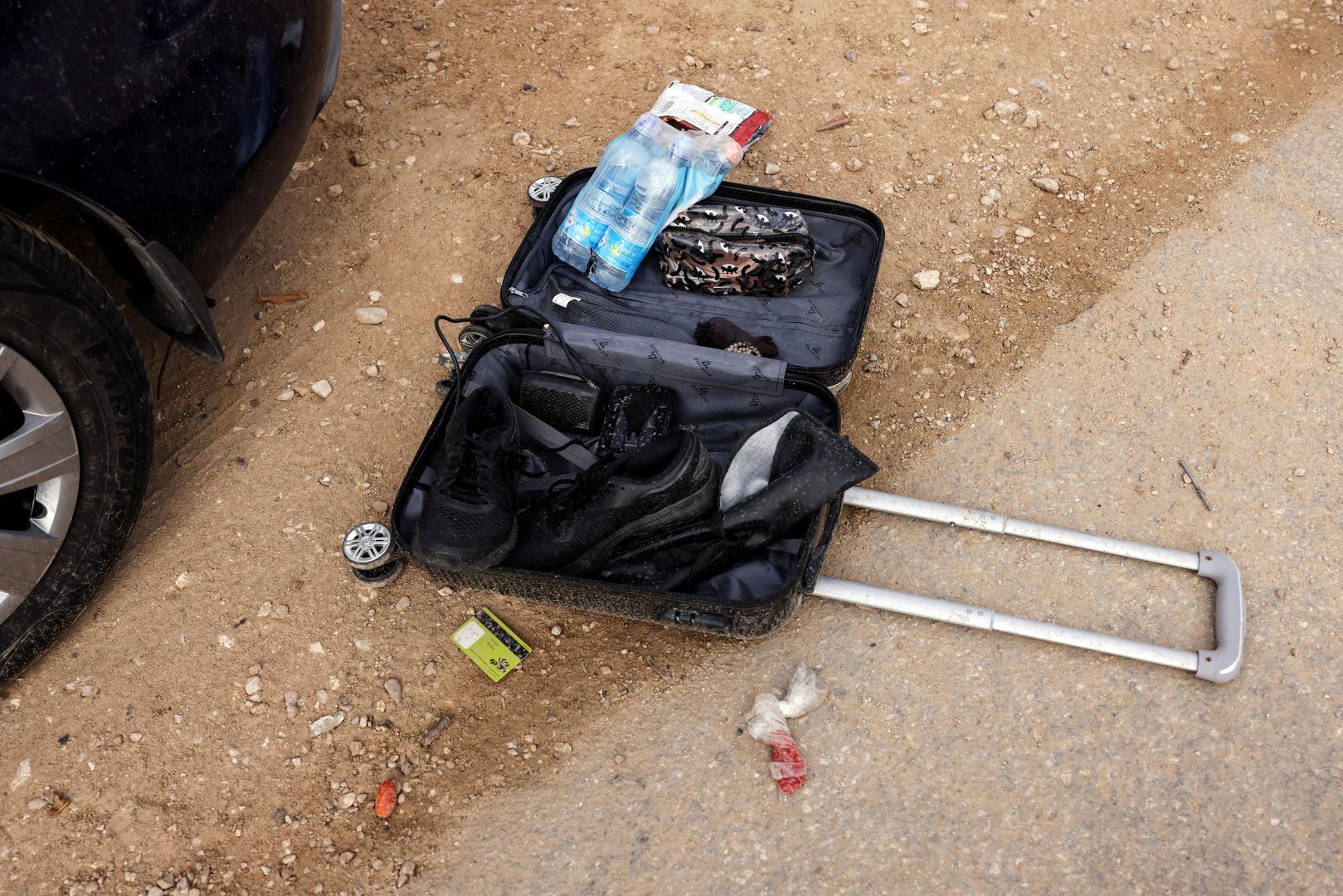 Ammunition and bullet shells are seen near someone's personal belongings in an abandoned carpark near where a festival was held before an attack by Hamas gunmen from Gaza that left at least 260 people dead, by Israel's border with Gaza in southern Israel, October 10, 2023. REUTERS/Ronen Zvulun Photo: RONEN ZVULUN/REUTERS