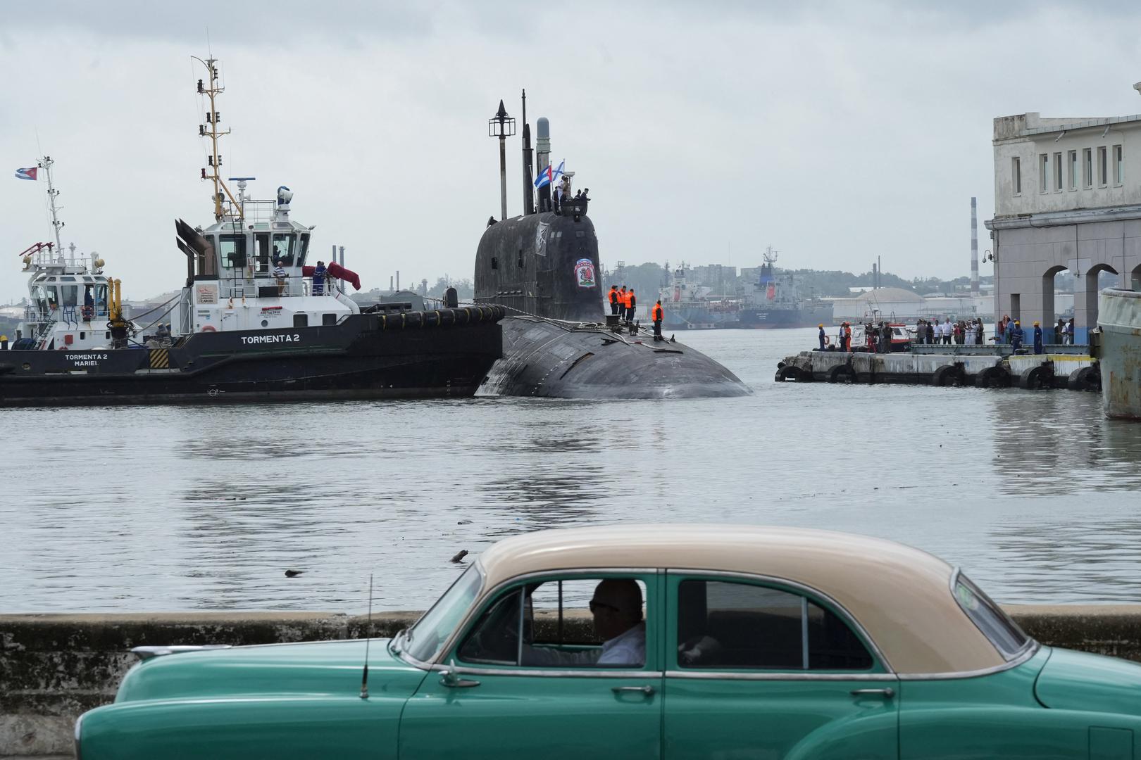 A vintage car passes by as Russian nuclear-powered cruise missile submarine Kazan docks in Havana’s bay, Cuba, June 12, 2024. REUTERS/Alexandre Meneghini Photo: ALEXANDRE MENEGHINI/REUTERS