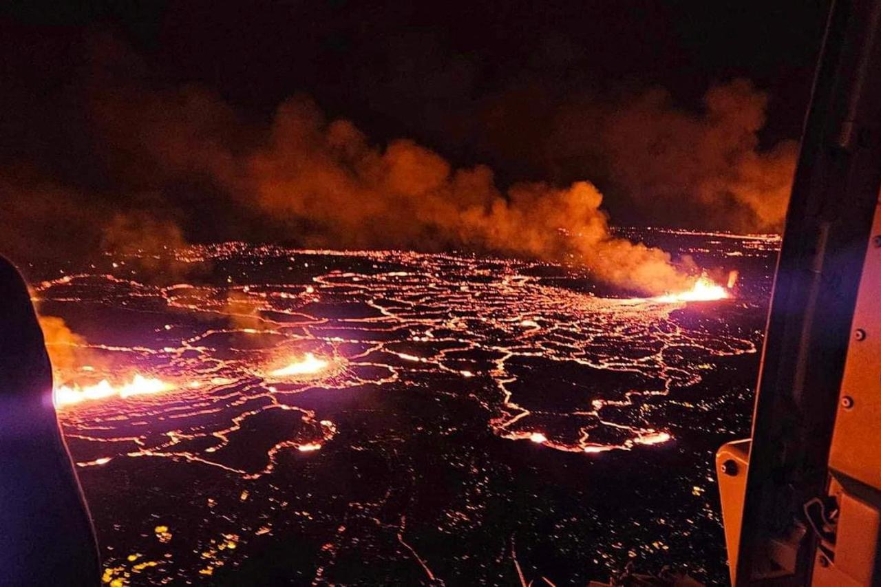 A volcano spews lava and smoke as it erupts near Grindavik